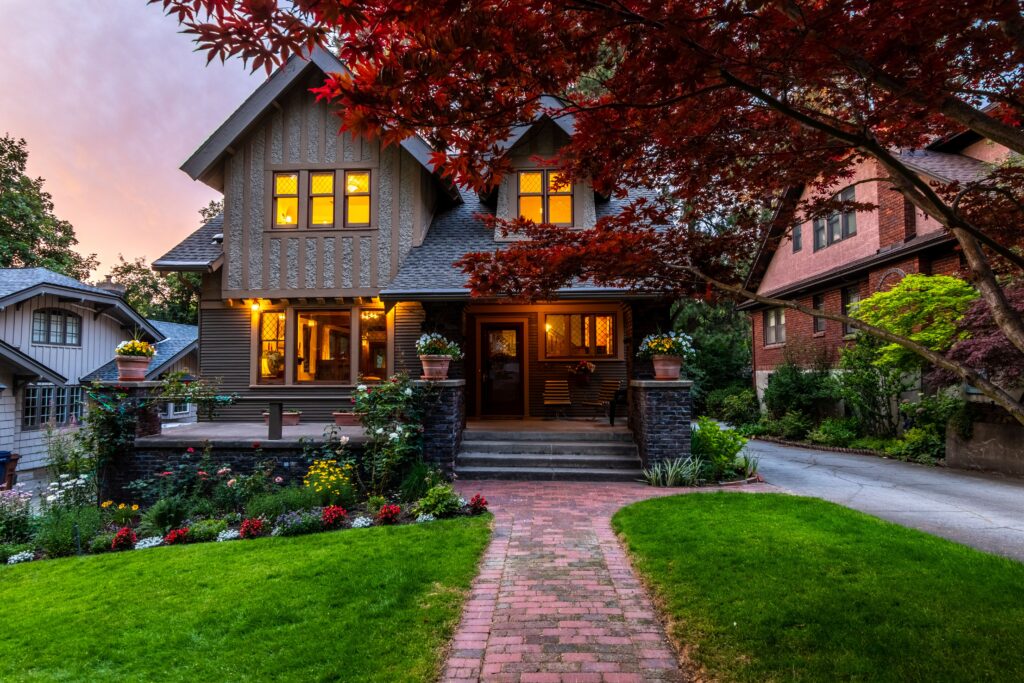 A picturesque suburban house with a lush garden, captured at twilight. Perfect for real estate and lifestyle themes.